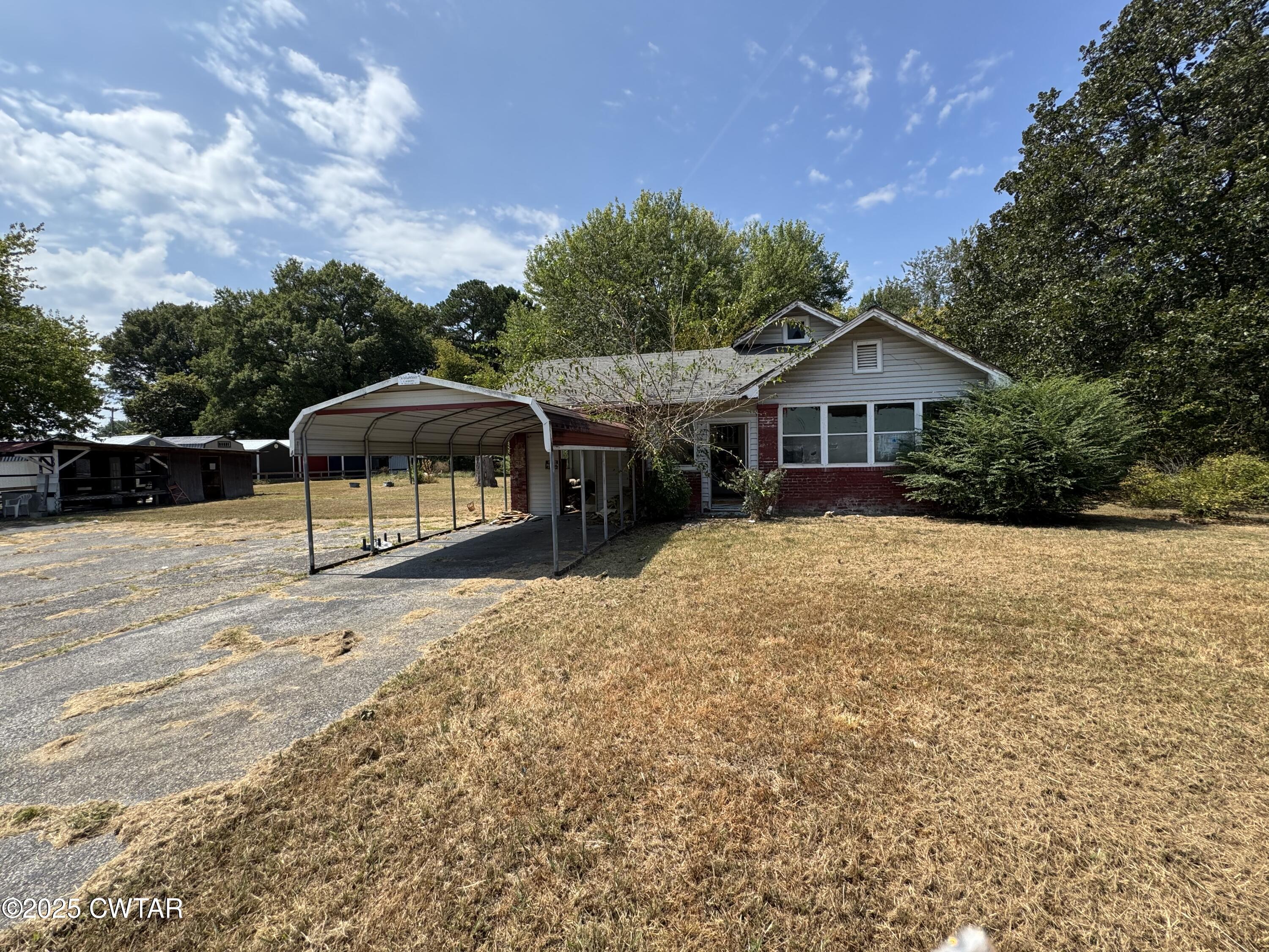 206 Medina Highway Milan, TN 38358 - Photo 7 of 10 a view of a house with a yard