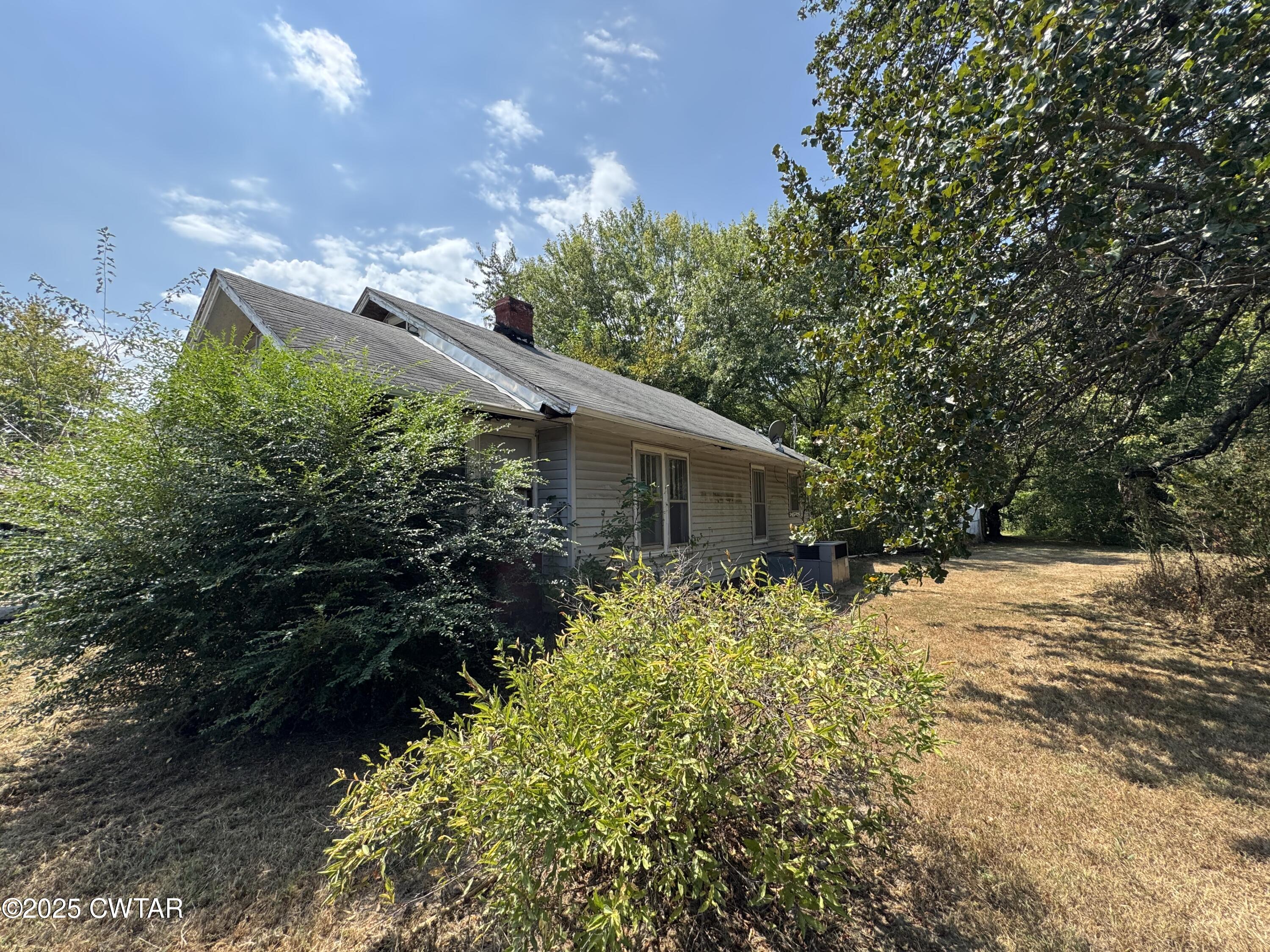 206 Medina Highway Milan, TN 38358 - Photo 8 of 10 a backyard of a house with lots of green space