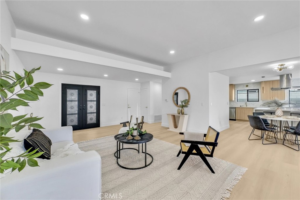 13682 Carroll Way Tustin, CA 92780 - Photo 18 of 51 a living room with furniture and potted plants