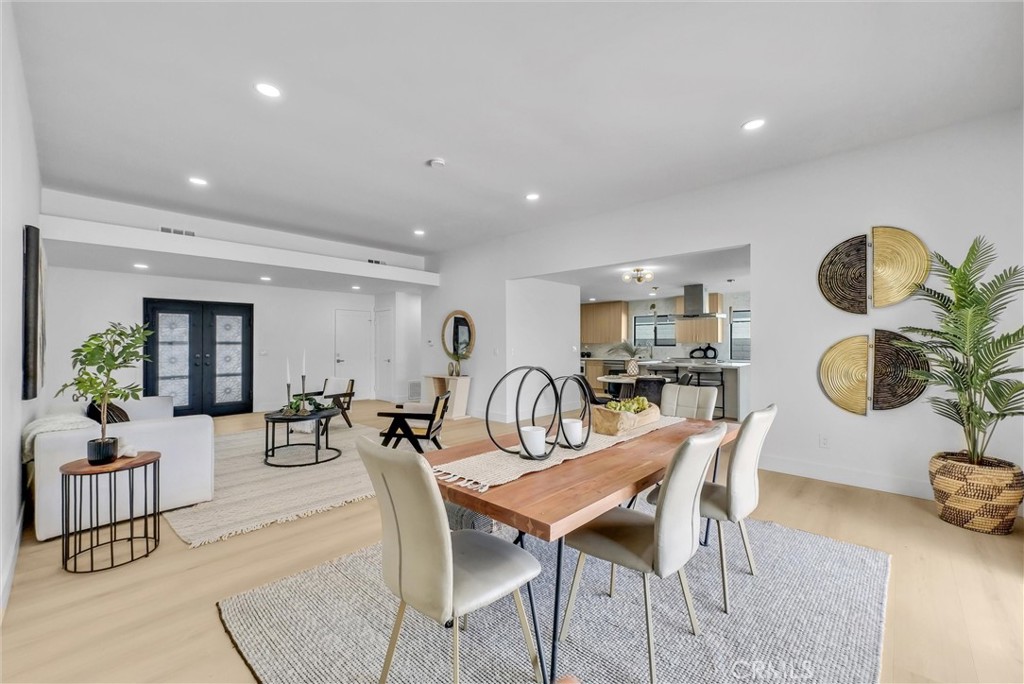 13682 Carroll Way Tustin, CA 92780 - Photo 20 of 51 a dining room with furniture and wooden floor