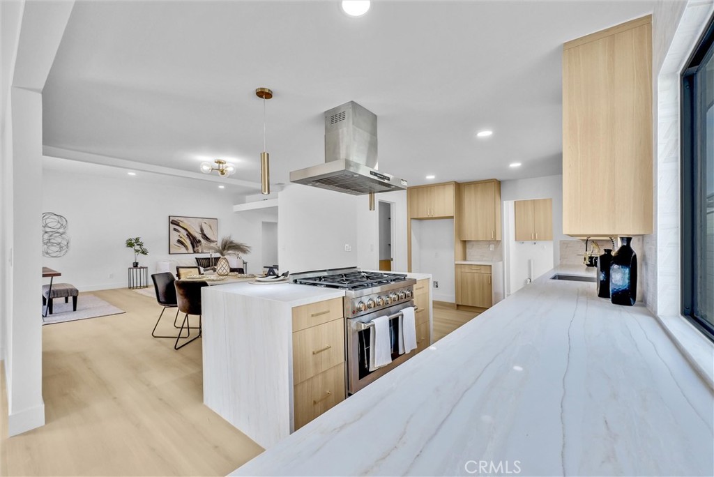 13682 Carroll Way Tustin, CA 92780 - Photo 29 of 51 a kitchen with a stove and a wooden floors