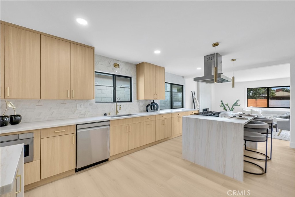 13682 Carroll Way Tustin, CA 92780 - Photo 3 of 51 a kitchen with stainless steel appliances a sink stove and cabinets