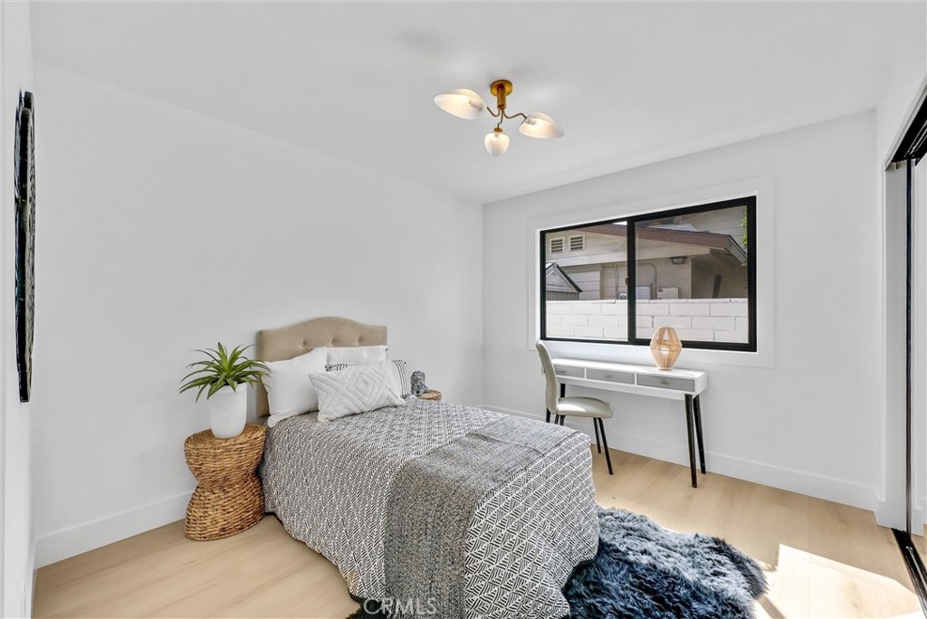 13682 Carroll Way Tustin, CA 92780 - Photo 36 of 51 a bedroom with a bed and a table