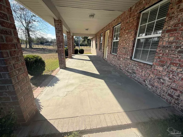 a view of a porch with a backyard