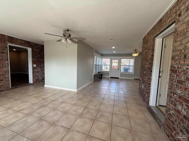 a view of a livingroom with furniture and windows