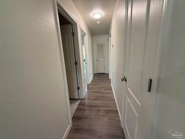 a bathroom with a bathtub sink and mirror