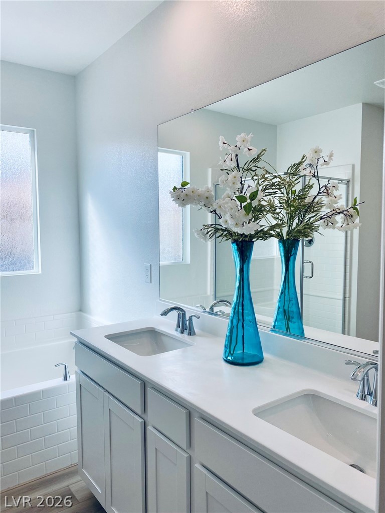 4457 Sawyer Ridge Street Las Vegas, NV 89147 - Photo 26 of 32 This serene bathroom offers a bright and clean aesthetic, perfect for unwinding.