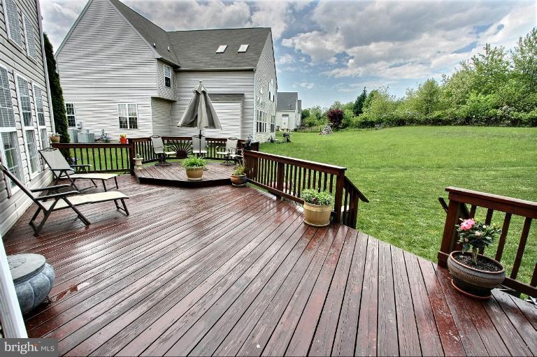 13929 Rockingham Road Germantown, MD 20874 - Photo 22 of 30 Custom deck overlooks rear yard