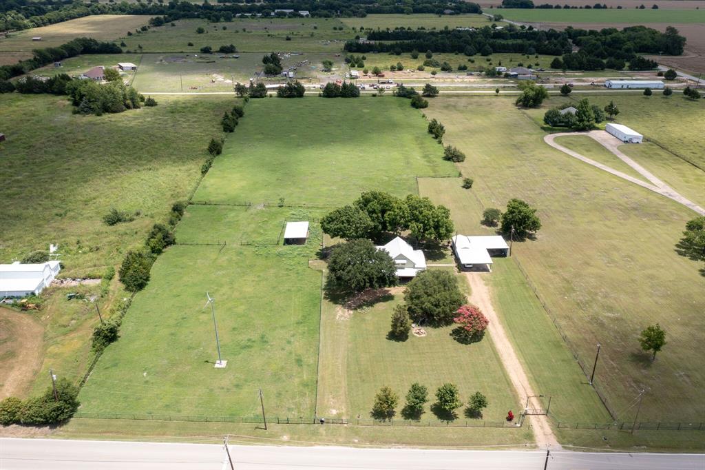 334 South Goode Road Wilmer, TX 75172 - Photo 6 of 14 Aerial view of property and surrounding area with rural landscape and a pastoral area