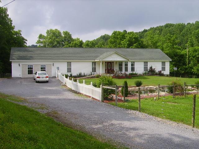 1909 Galen Road Lafayette, TN 37083 - Photo 1 of 17 "Custom" Site Built Home 4BR w/Office or 5BR/2 Bath w/Jacuzzi Tub, Fireplace, Pool, Covered Porches, City Water and C/H/A. This Secluded Property has a Detached Garage, Barn/Stable and Year Round Creek. Only 5 minutes from Lafayette Town Square.