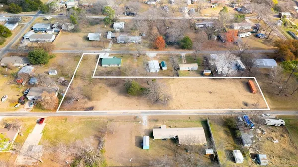 a view of a backyard with swimming pool