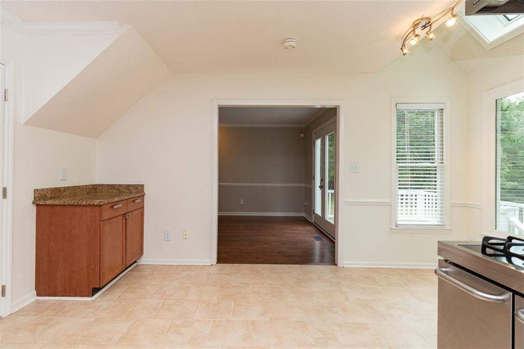 9317 Meadow Rue Place Raleigh, NC 27603 - Photo 12 of 36 en empty room with windows and wardrobe