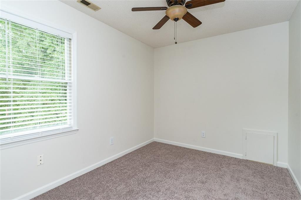 9317 Meadow Rue Place Raleigh, NC 27603 - Photo 18 of 36 a view of an empty room with a window