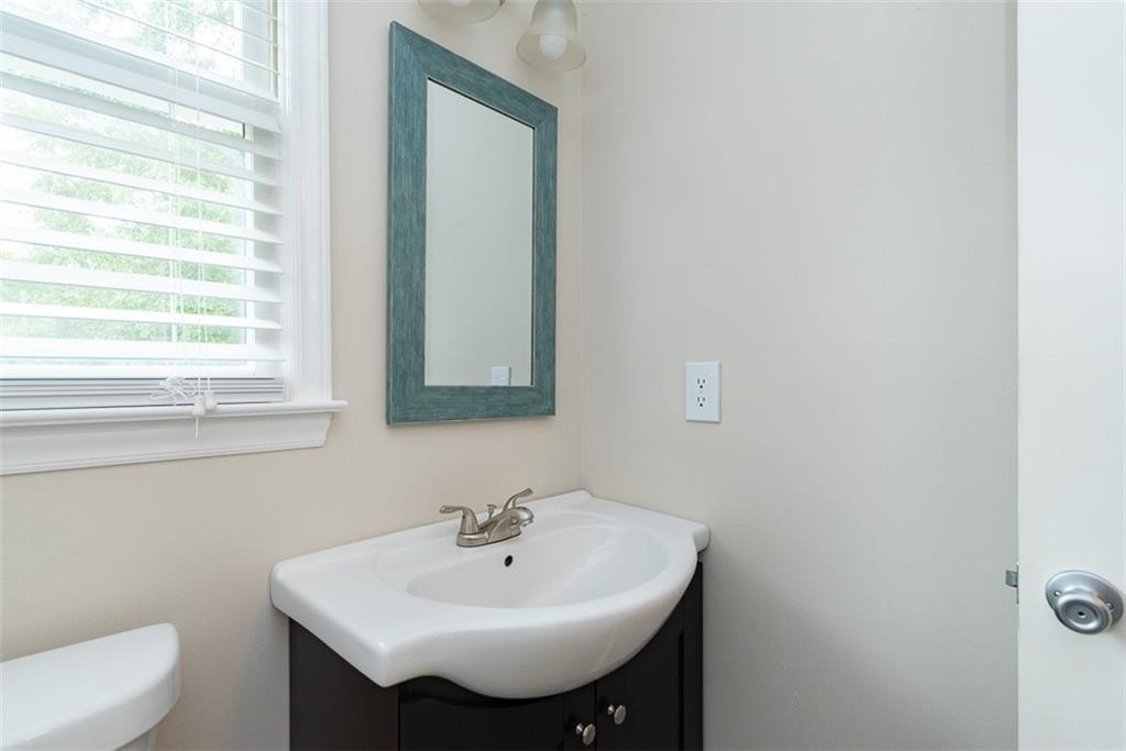 9317 Meadow Rue Place Raleigh, NC 27603 - Photo 20 of 36 a bathroom with a sink and a toilet