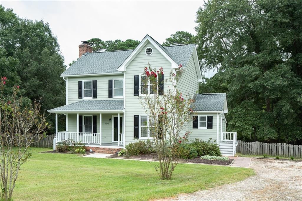 9317 Meadow Rue Place Raleigh, NC 27603 - Photo 2 of 36 a front view of a house with a yard