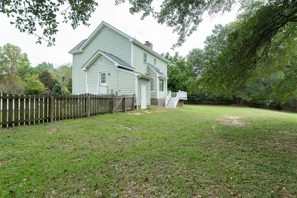 9317 Meadow Rue Place Raleigh, NC 27603 - Photo 36 of 36 a view of a house with yard and tree s