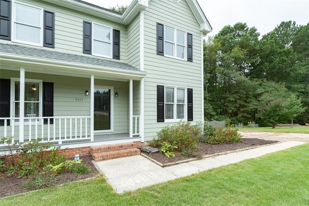 9317 Meadow Rue Place Raleigh, NC 27603 - Photo 4 of 36 a view of a house with a yard