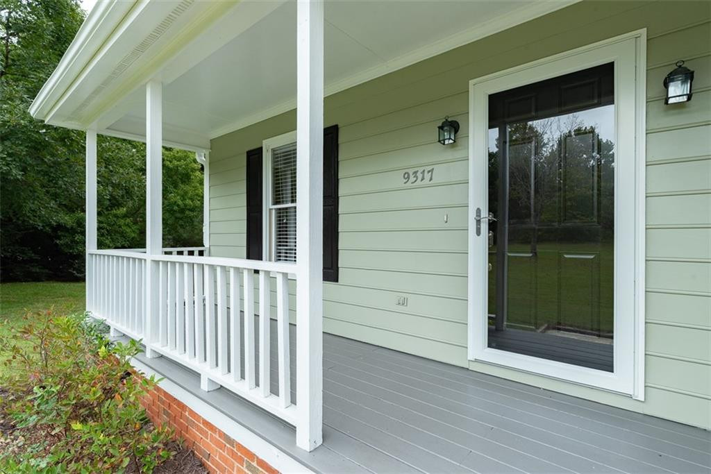 9317 Meadow Rue Place Raleigh, NC 27603 - Photo 5 of 36 a view of a house with a porch
