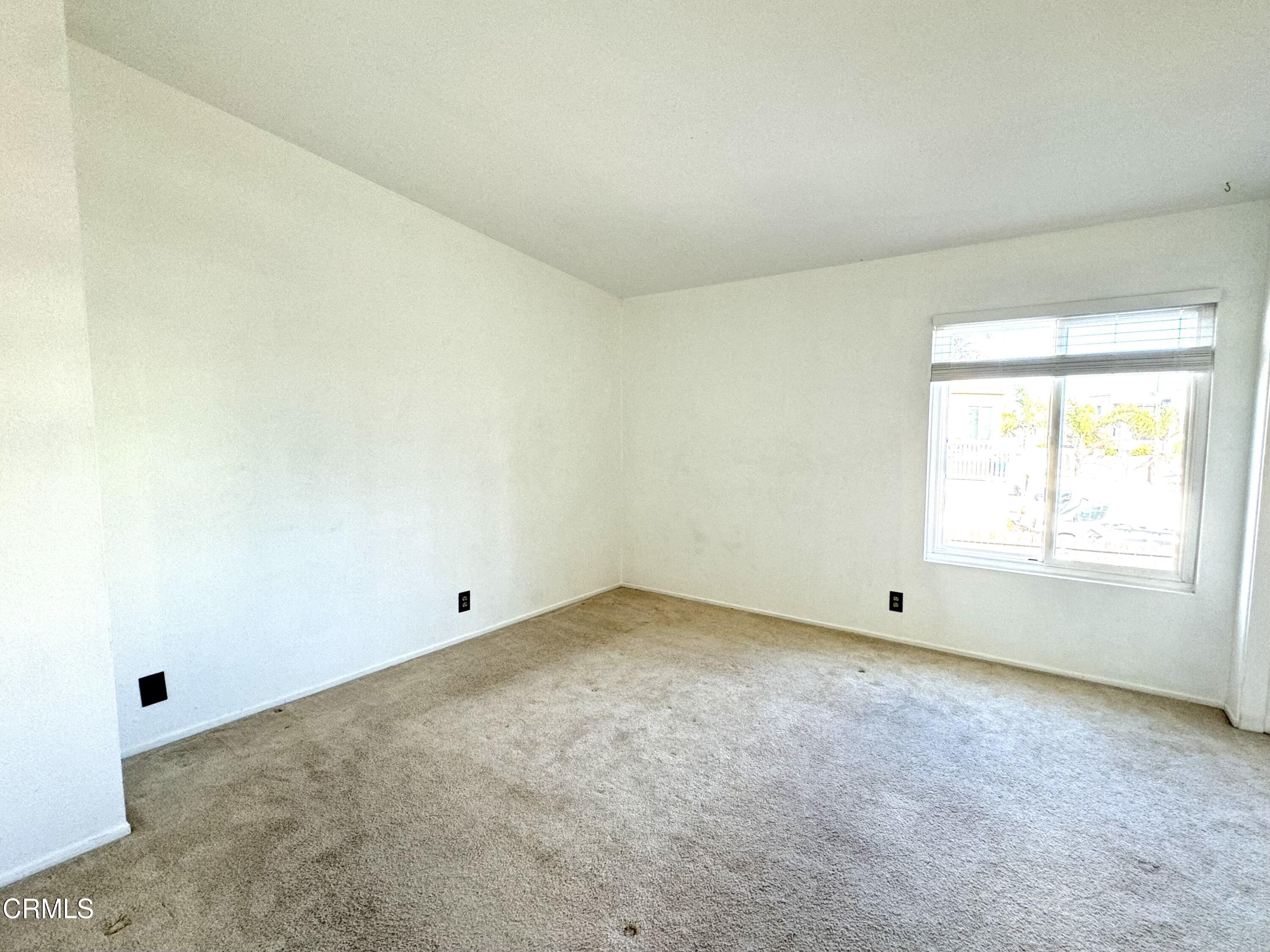 1031 Dunes Street, Unit D Oxnard, CA 93035 - Photo 11 of 26 an empty room with a window
