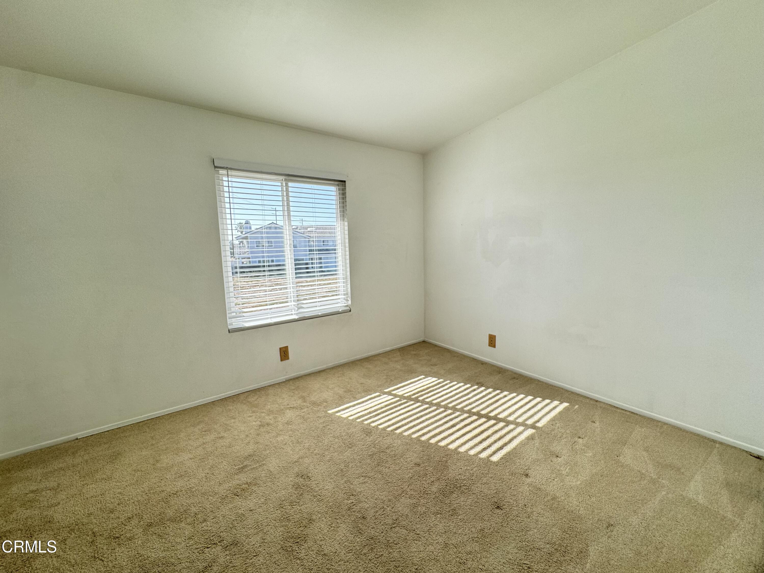 1031 Dunes Street, Unit D Oxnard, CA 93035 - Photo 12 of 26 a view of an empty room with a window