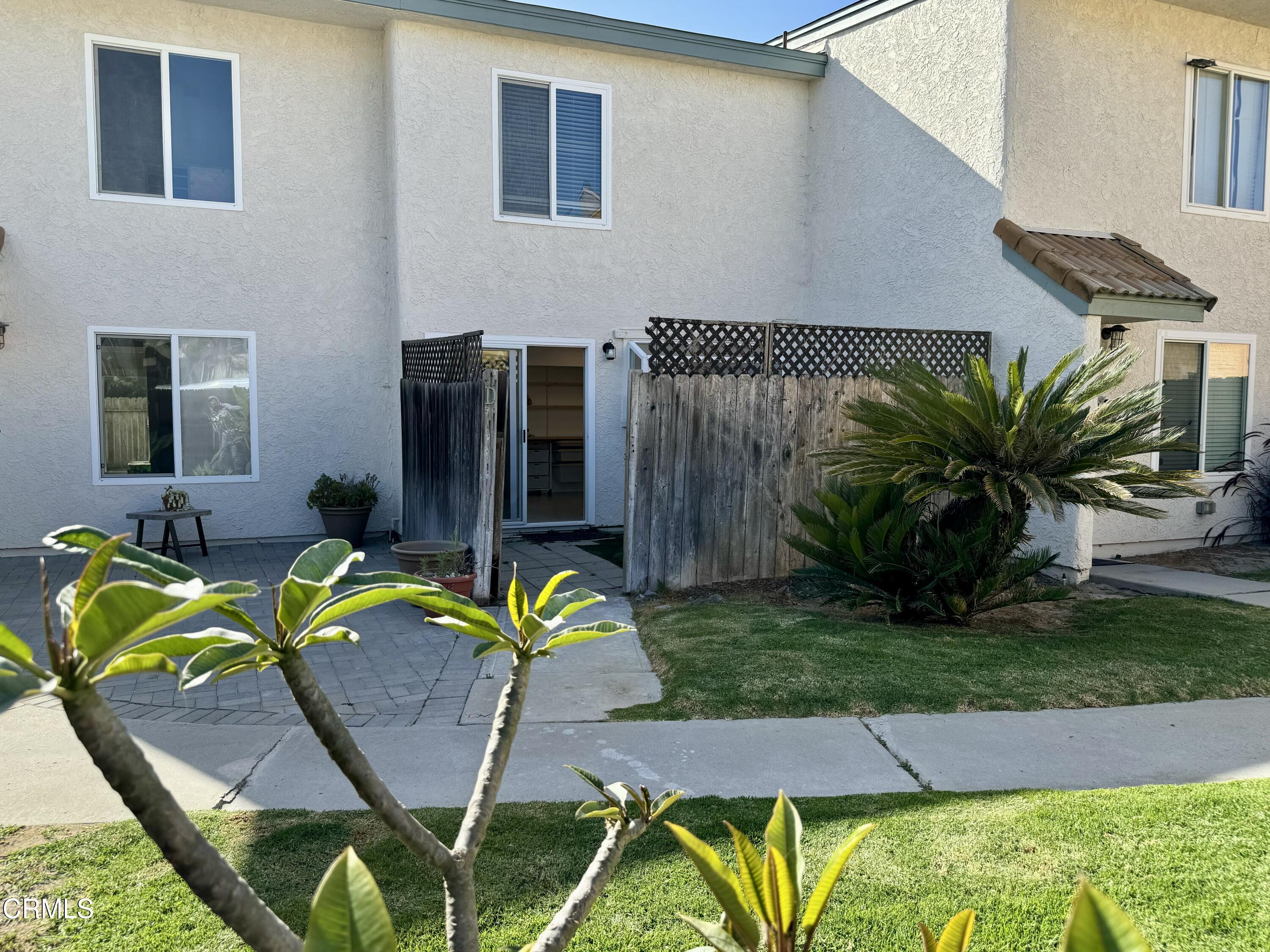1031 Dunes Street, Unit D Oxnard, CA 93035 - Photo 14 of 26 a view of a house with backyard and sitting area