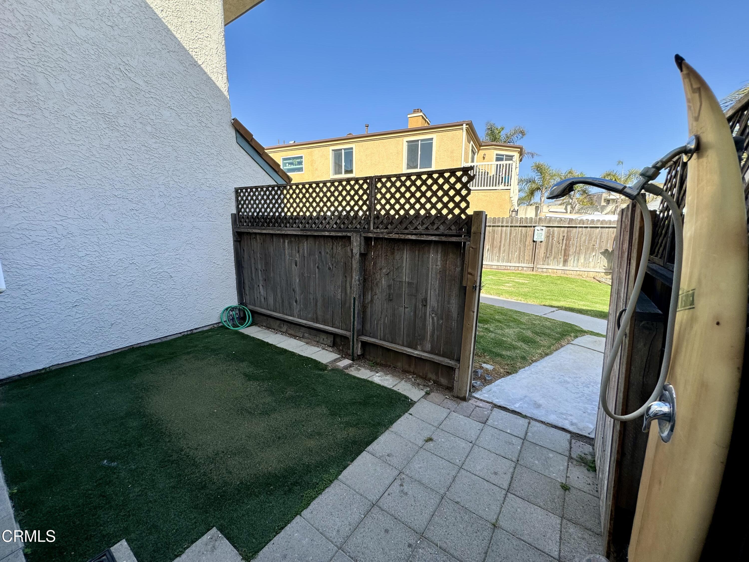1031 Dunes Street, Unit D Oxnard, CA 93035 - Photo 15 of 26 a view of a backyard with a garden