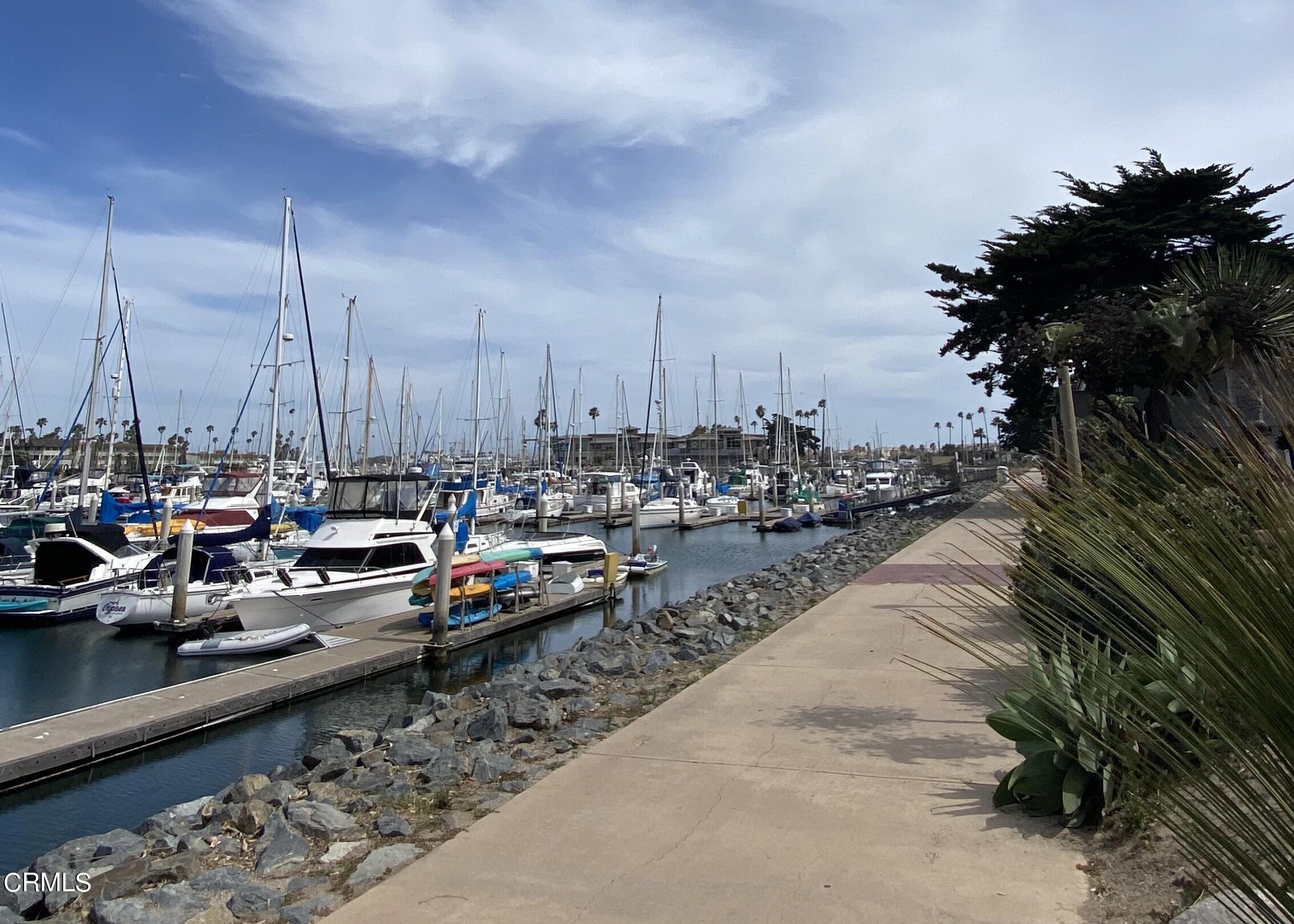 1031 Dunes Street, Unit D Oxnard, CA 93035 - Photo 18 of 26 a view of swimming pool with chairs