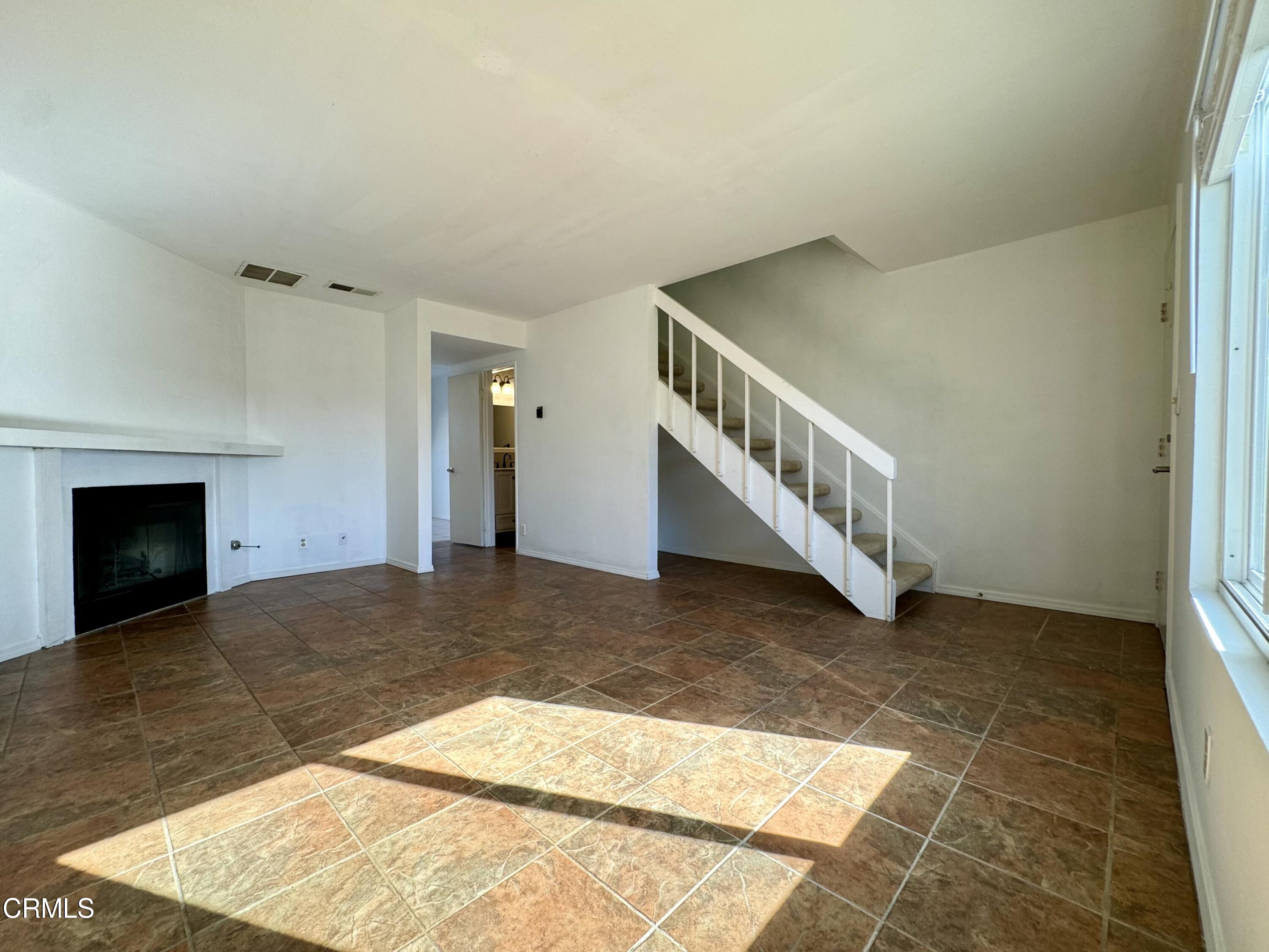 1031 Dunes Street, Unit D Oxnard, CA 93035 - Photo 2 of 26 a view of an entryway with staircase