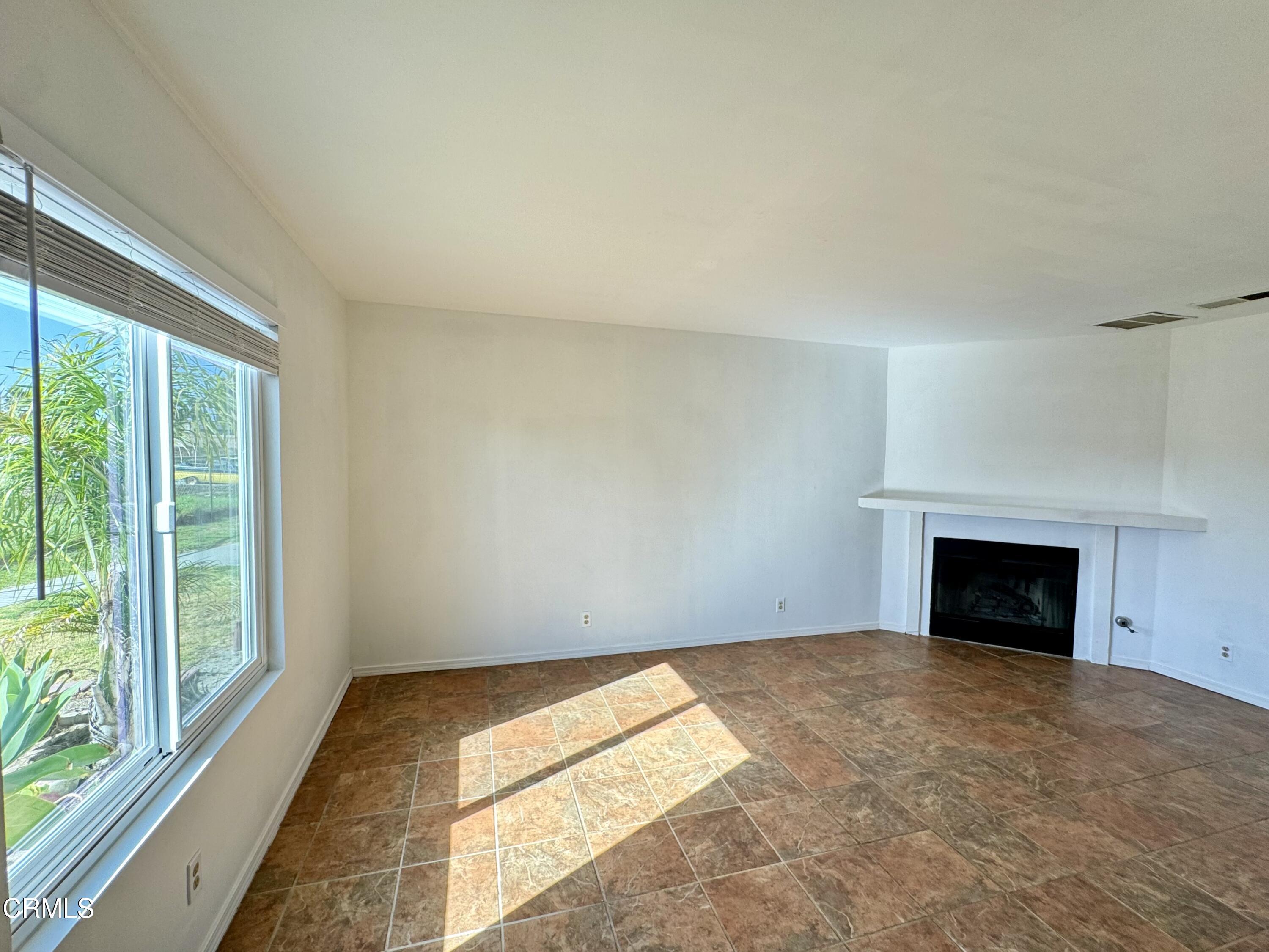 1031 Dunes Street, Unit D Oxnard, CA 93035 - Photo 3 of 26 a view of empty room with a fireplace