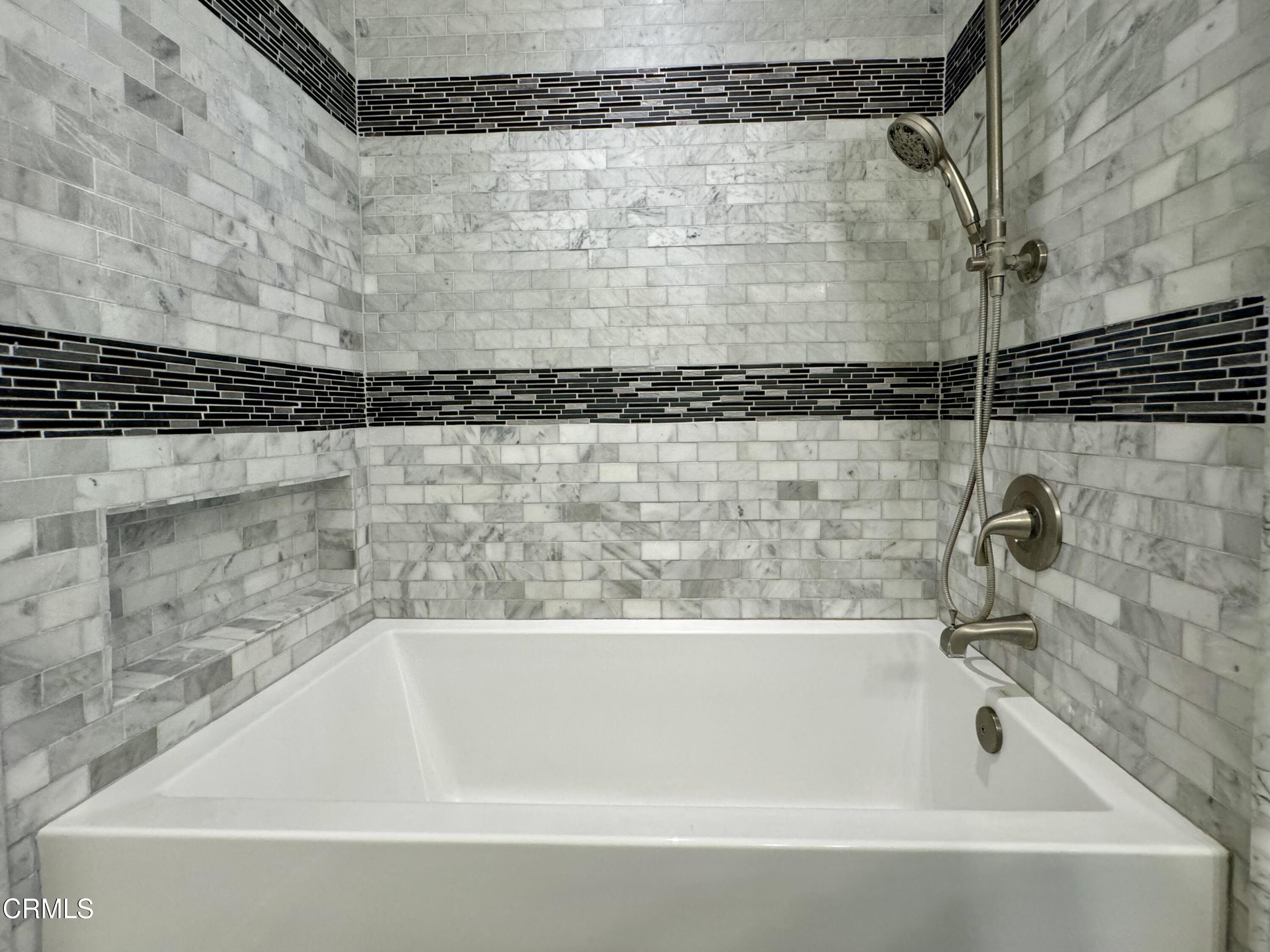 1031 Dunes Street, Unit D Oxnard, CA 93035 - Photo 9 of 26 a bathroom with a bathtub