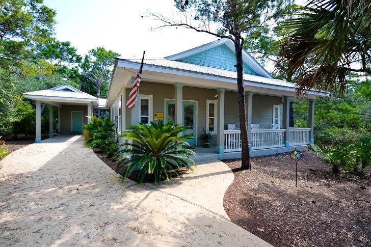 53 Maple Street Santa Rosa Beach, FL 32459 - Photo 1 of 14 a view of a house with potted plants and a large tree