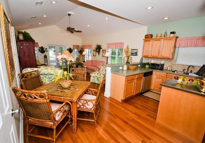 53 Maple Street Santa Rosa Beach, FL 32459 - Photo 6 of 14 a very nice looking kitchen with a large counter space appliances and wooden floor