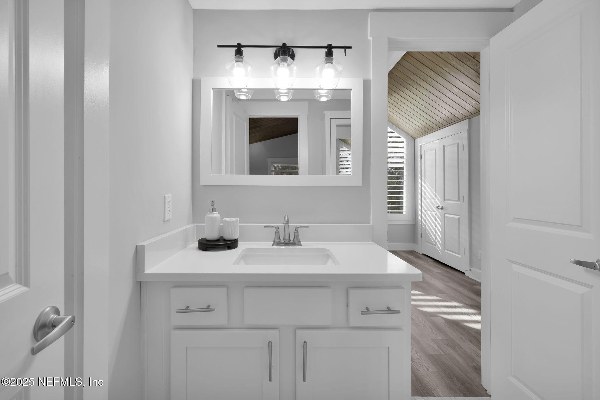 431 19th Street North Jacksonville Beach, FL 32250 - Photo 28 of 53 a bathroom with a sink and a mirror