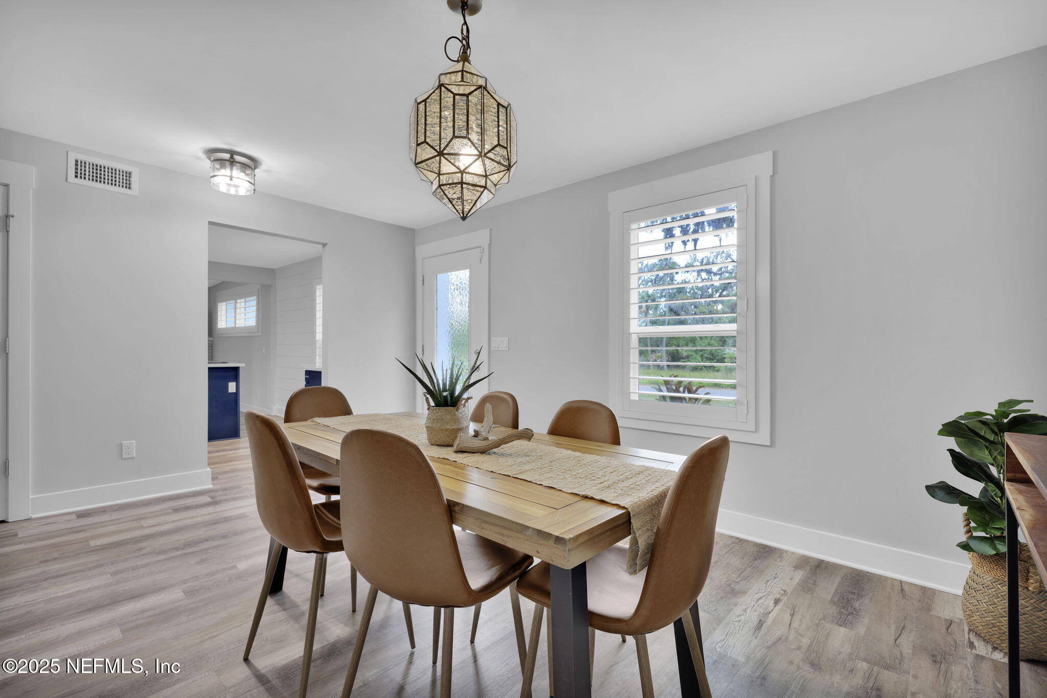 431 19th Street North Jacksonville Beach, FL 32250 - Photo 7 of 53 a view of a dining room with furniture window and wooden floor