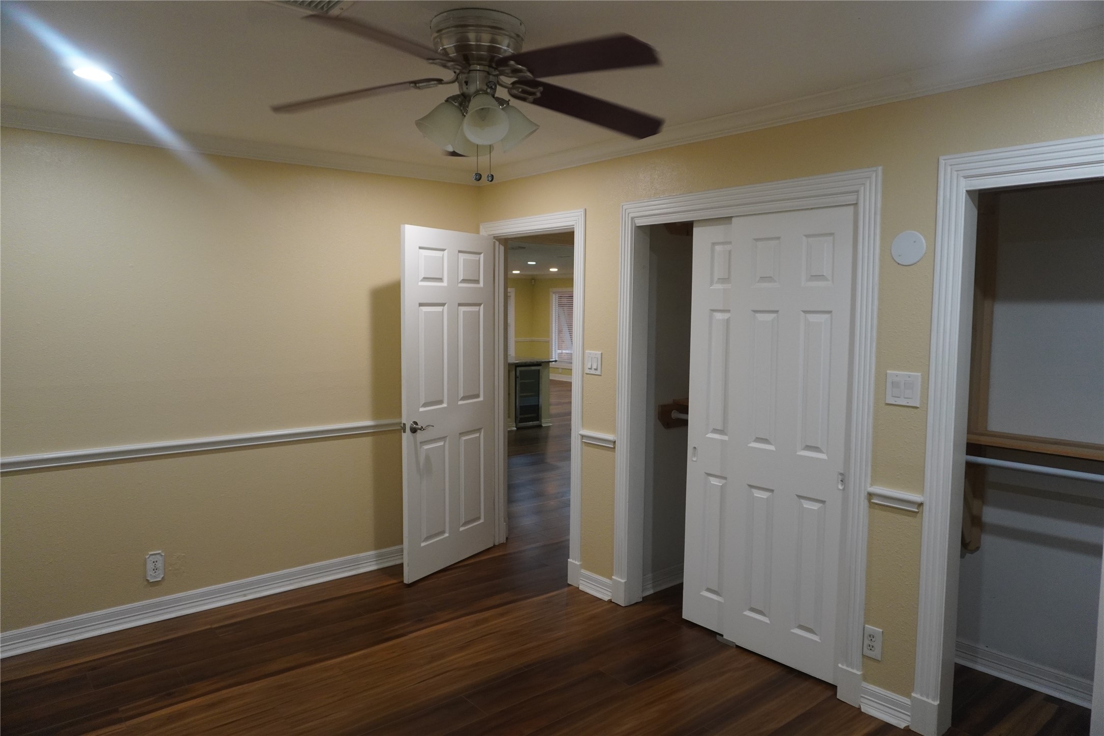 7506 Dearborn Street Houston, TX 77055 - Photo 6 of 15 an empty room with wooden floor closet and windows