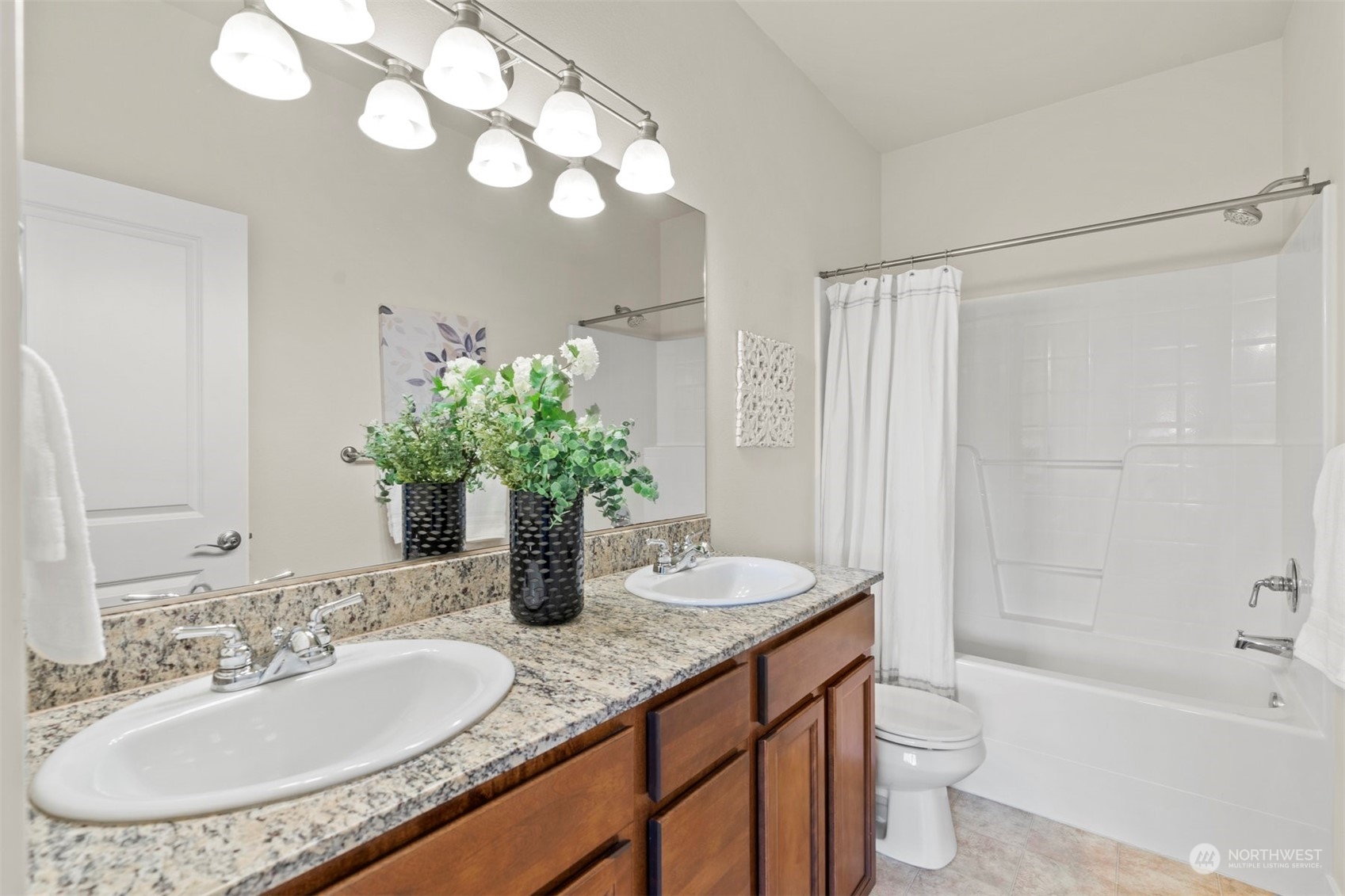 2026 112th Street Southwest Everett, WA 98204 - Photo 19 of 33 a bathroom with a granite countertop sink a toilet and shower