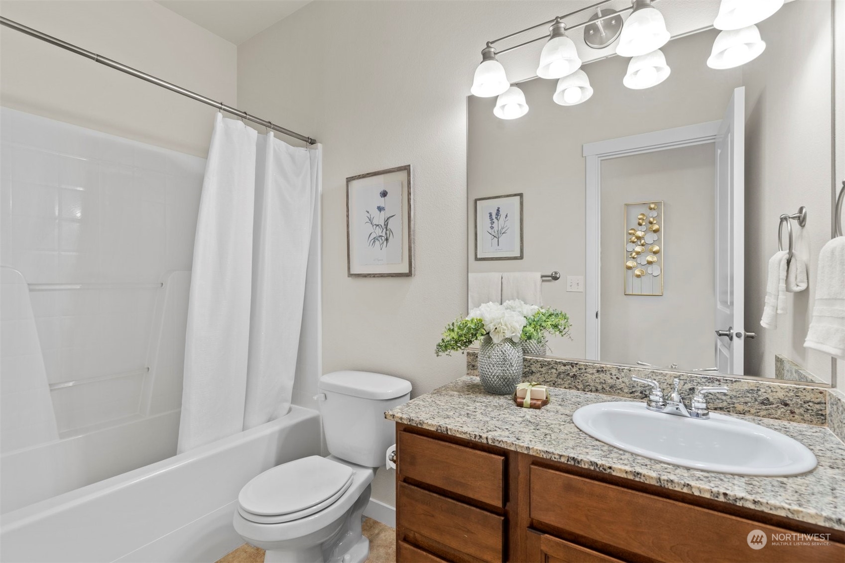2026 112th Street Southwest Everett, WA 98204 - Photo 21 of 33 a bathroom with a granite countertop sink toilet a large mirror a shower and a bathtub