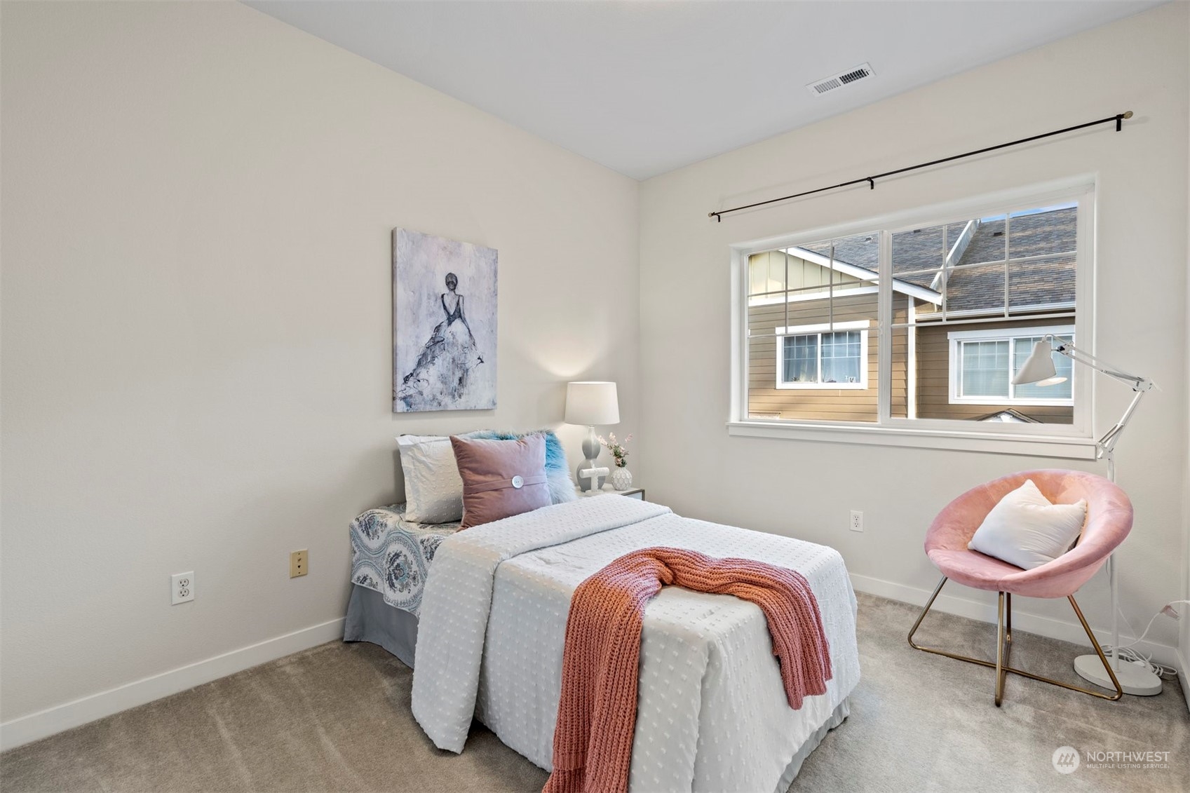 2026 112th Street Southwest Everett, WA 98204 - Photo 24 of 33 a bedroom with a bed and chair