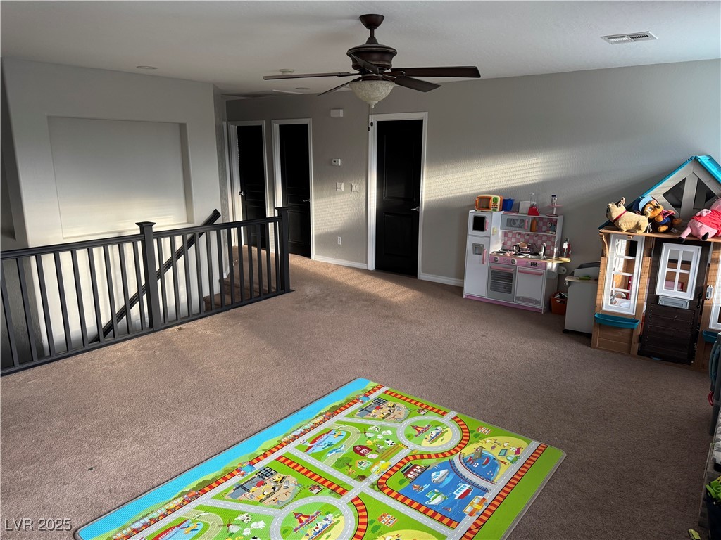 5522 Porcupine Rim Street Las Vegas, NV 89130 - Photo 11 of 28 Game room with carpet and ceiling fan