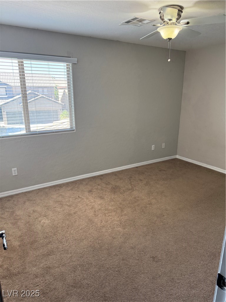 5522 Porcupine Rim Street Las Vegas, NV 89130 - Photo 16 of 28 Empty room with carpet floors and baseboards