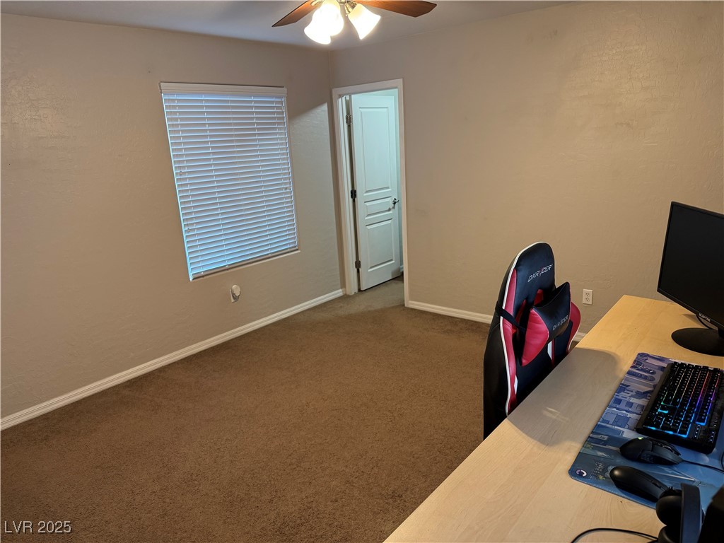 5522 Porcupine Rim Street Las Vegas, NV 89130 - Photo 19 of 28 Carpeted office space featuring ceiling fan and a textured wall