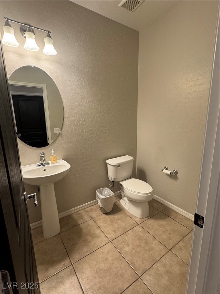 5522 Porcupine Rim Street Las Vegas, NV 89130 - Photo 22 of 28 Bathroom with a textured wall and light tile patterned flooring
