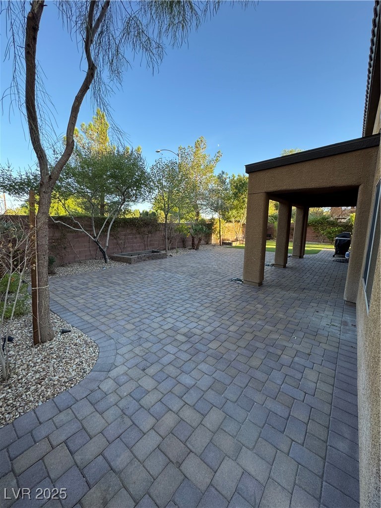 5522 Porcupine Rim Street Las Vegas, NV 89130 - Photo 23 of 28 Fenced backyard with a patio