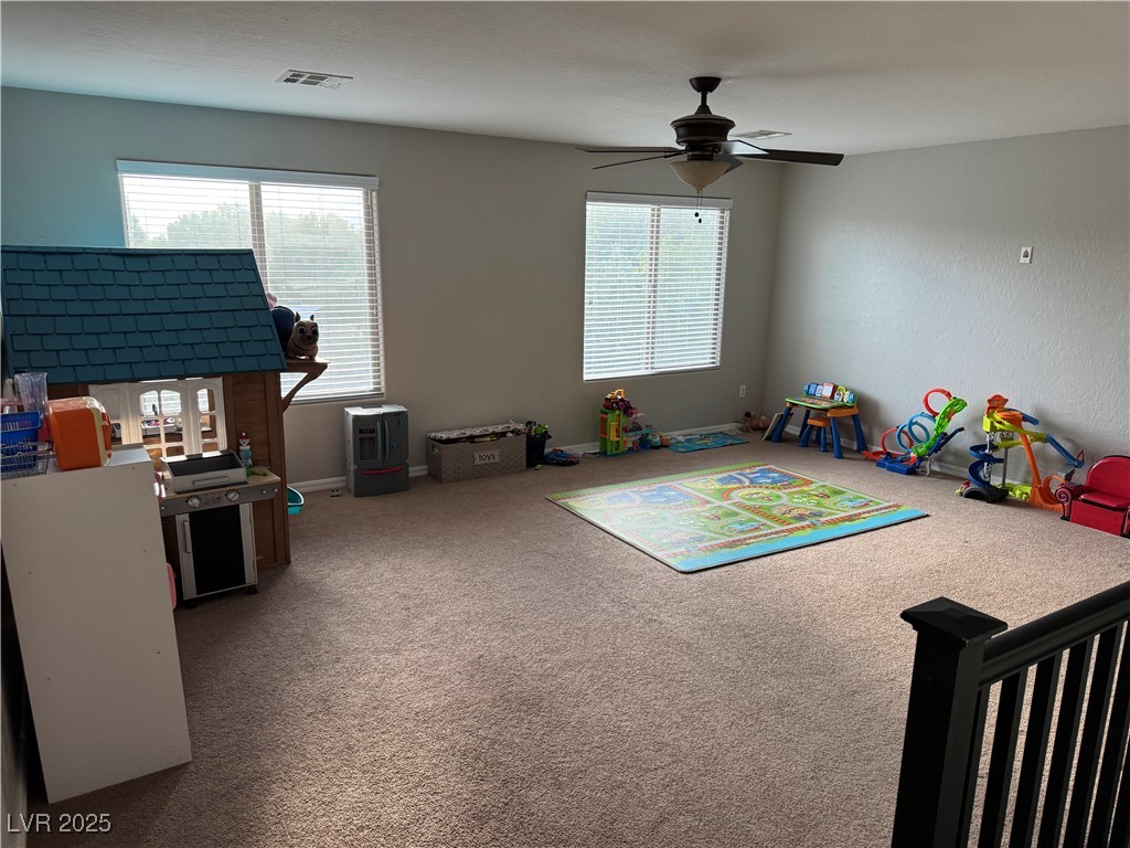 5522 Porcupine Rim Street Las Vegas, NV 89130 - Photo 10 of 28 Playroom featuring carpet flooring and ceiling fan