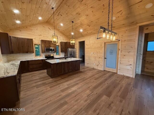 1841 Pinestand Rdg Way Sevierville, TN 37862 - Photo 3 of 23 a large kitchen with stainless steel appliances a large counter top a stove and a wooden floors