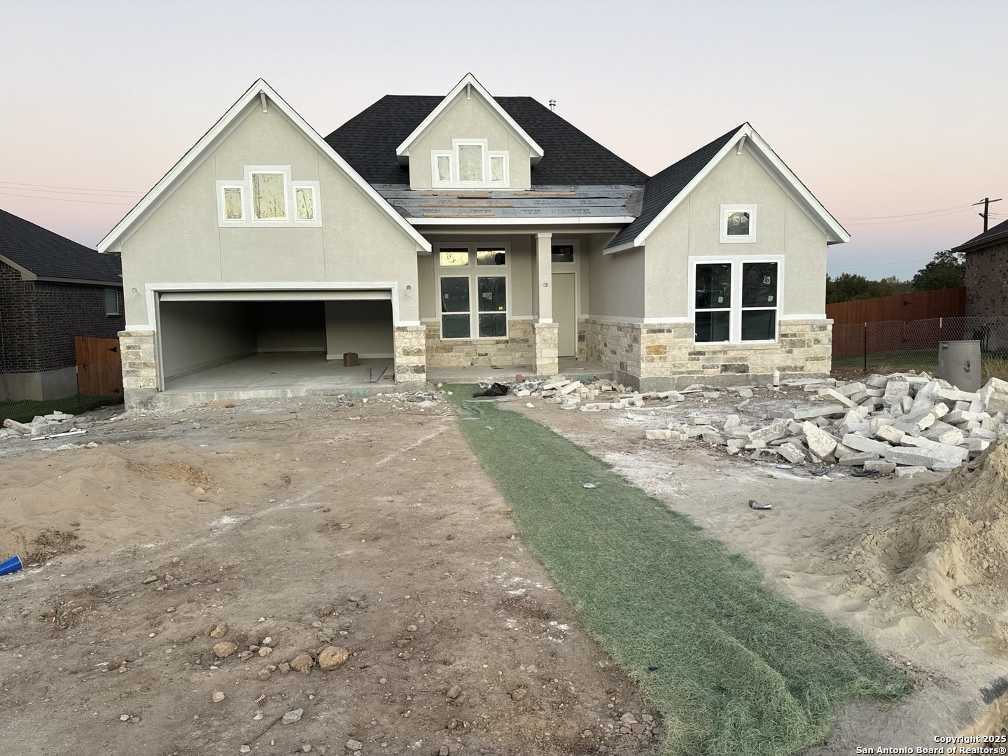 a front view of a house with a yard