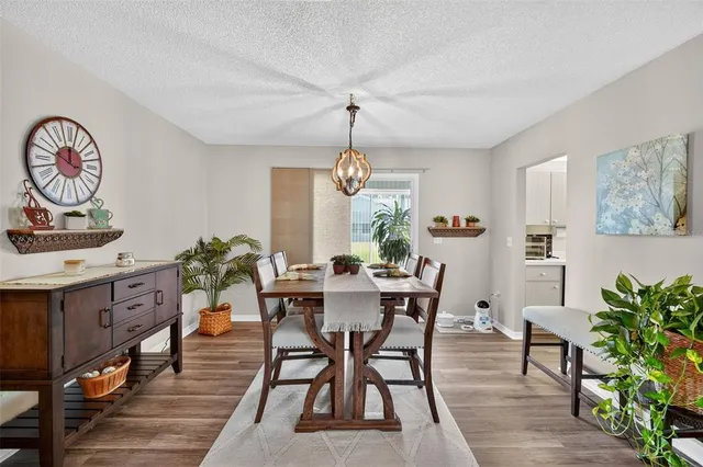 a kitchen with a refrigerator a sink and cabinets