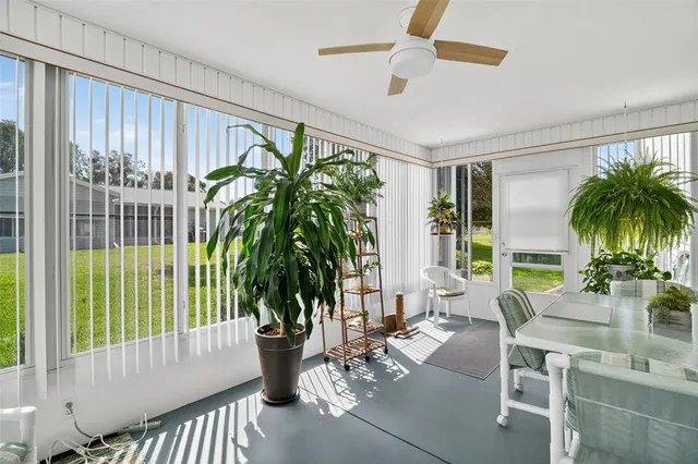 a view of a chair and fire pit in the balcony