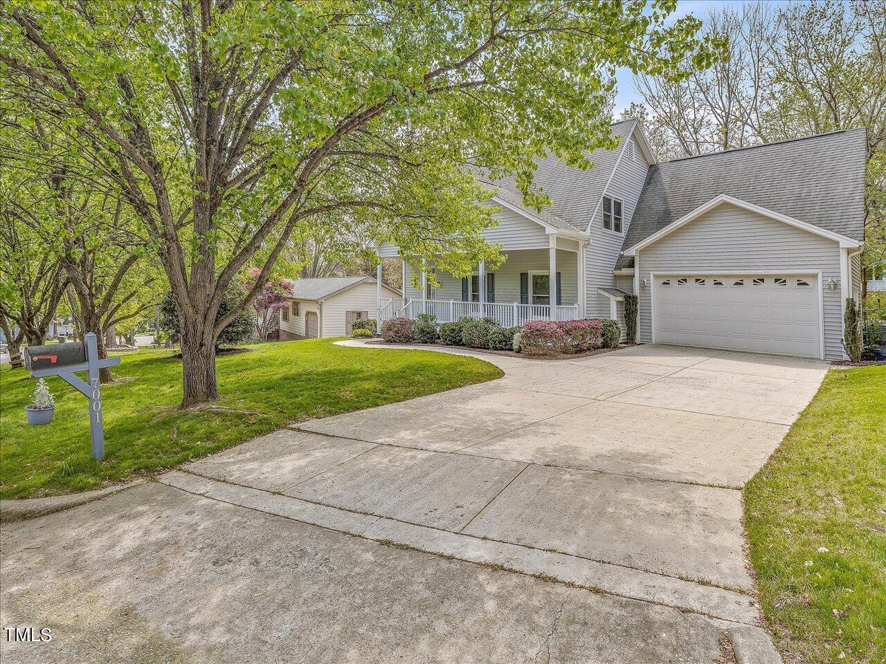 7001 Three Bridges Circle Raleigh, NC 27613 - Photo 1 of 25 a view of a house with a yard