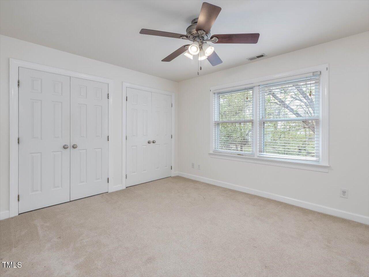 7001 Three Bridges Circle Raleigh, NC 27613 - Photo 18 of 25 a view of an empty room with a window